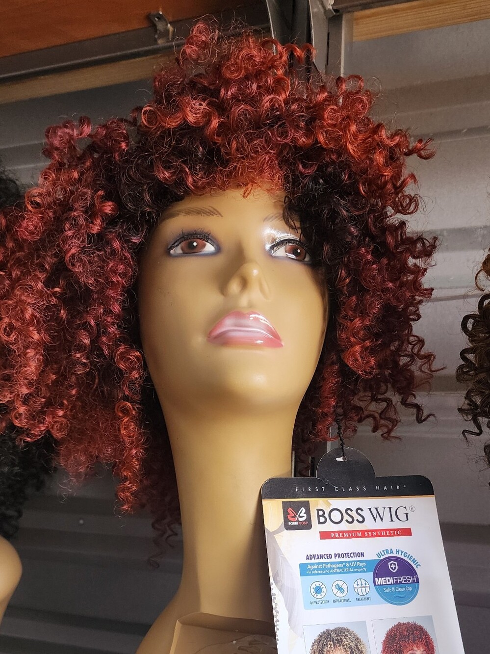 Bobbi Boss Women’s Curly Synthetic Wig in Burgundy Red